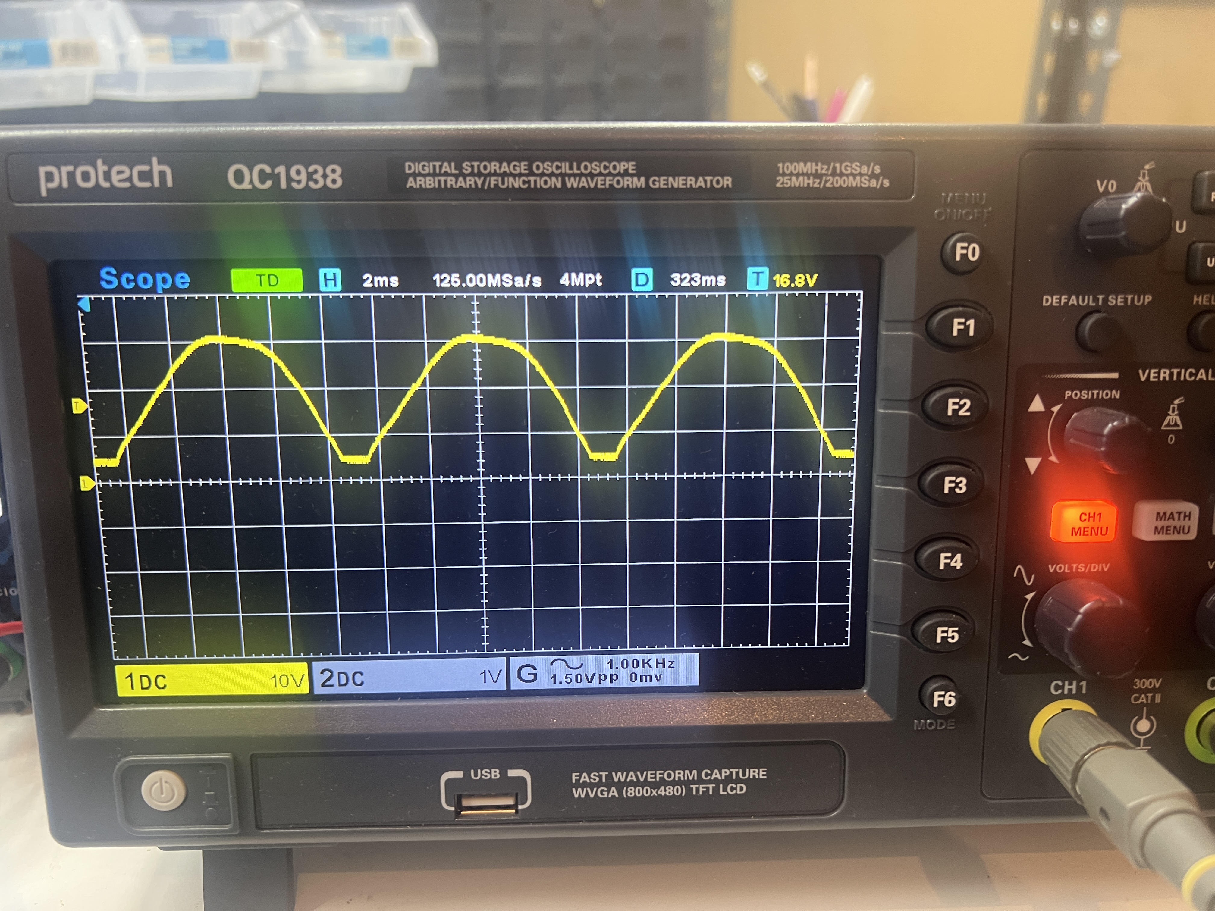 Oscilloscope displaying full-wave rectified AC with large ripple
