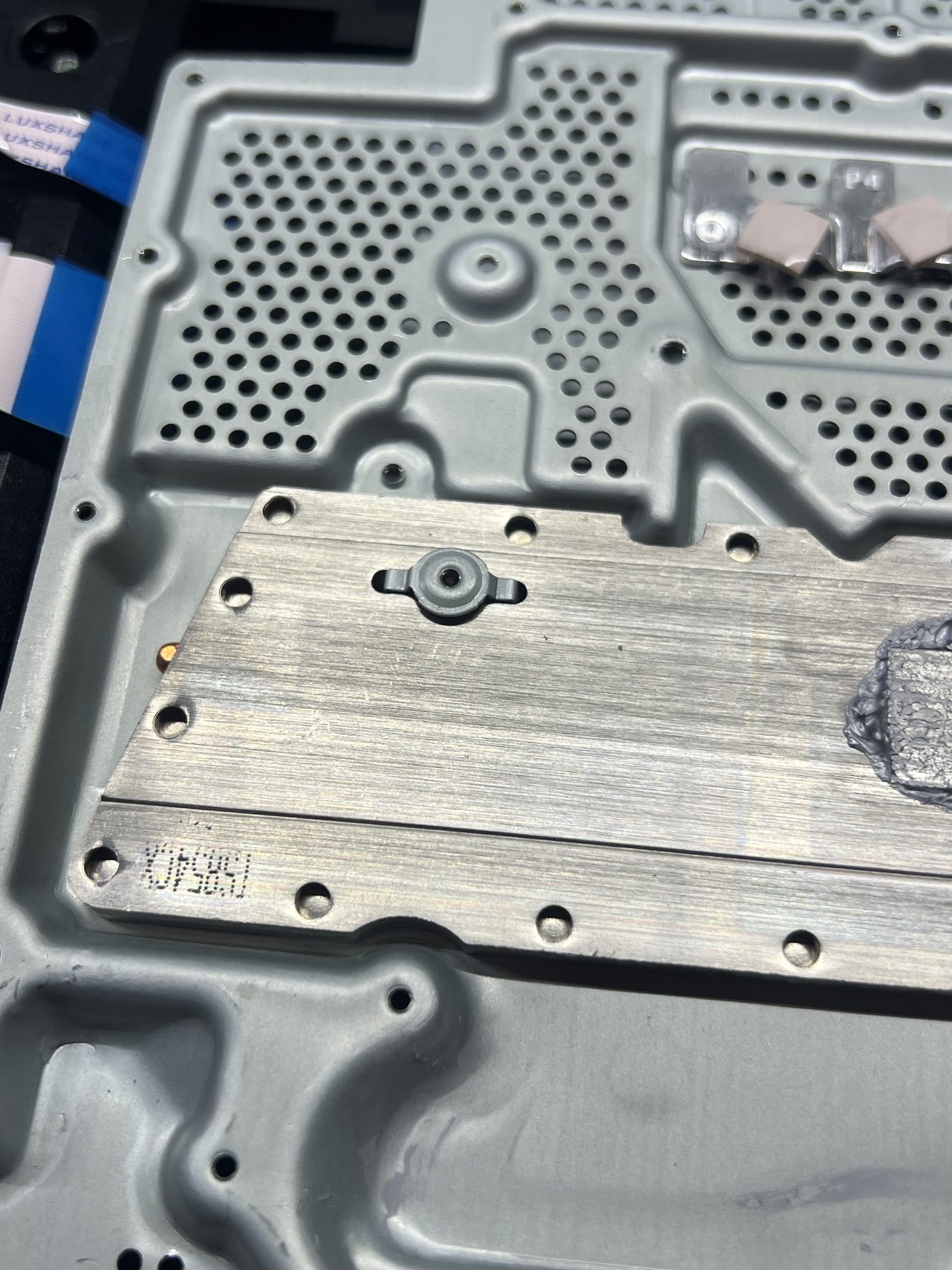 PS4 Slim heatsink assembly showing the mystery part installed