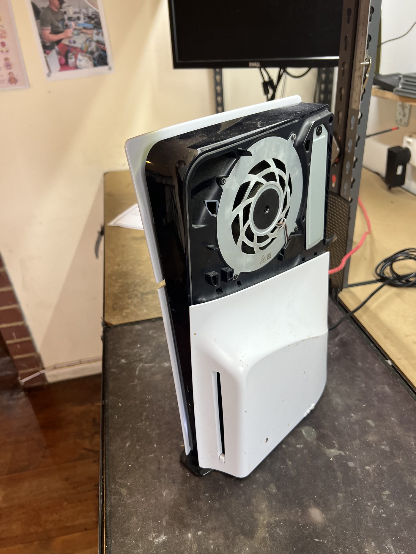 PS5 Slim at the start of the cleaning repair with the fan area exposed